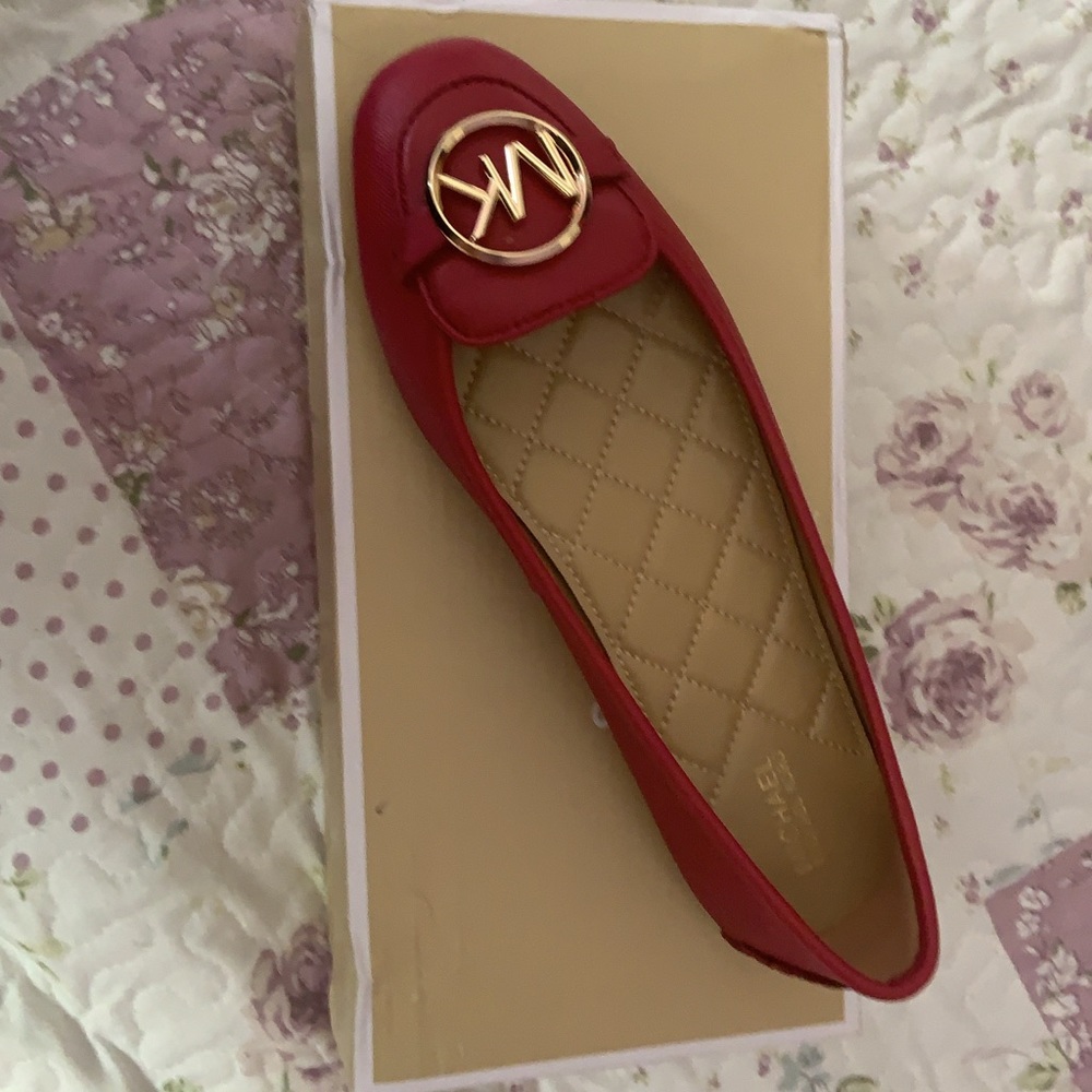 Mk flats in the color berry(sold)